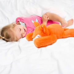 Niuniu Daddy fox weighted plush in lap use for calm focus.