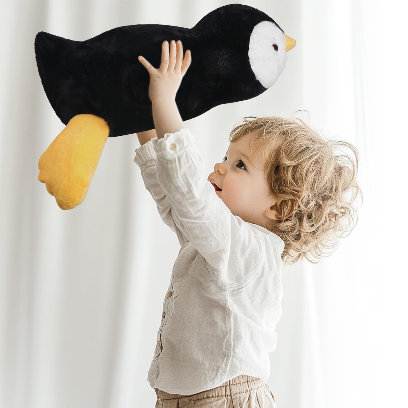 Niuniu Daddy penguin fluffy fur closeup highlights soft touch for cuddling.