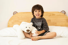 Niuniu Daddy polar bear weighted toy side view highlights cuddle-ready silhouette.