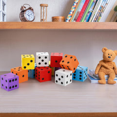 Noamus foam dice shown on a desk for organized learning.