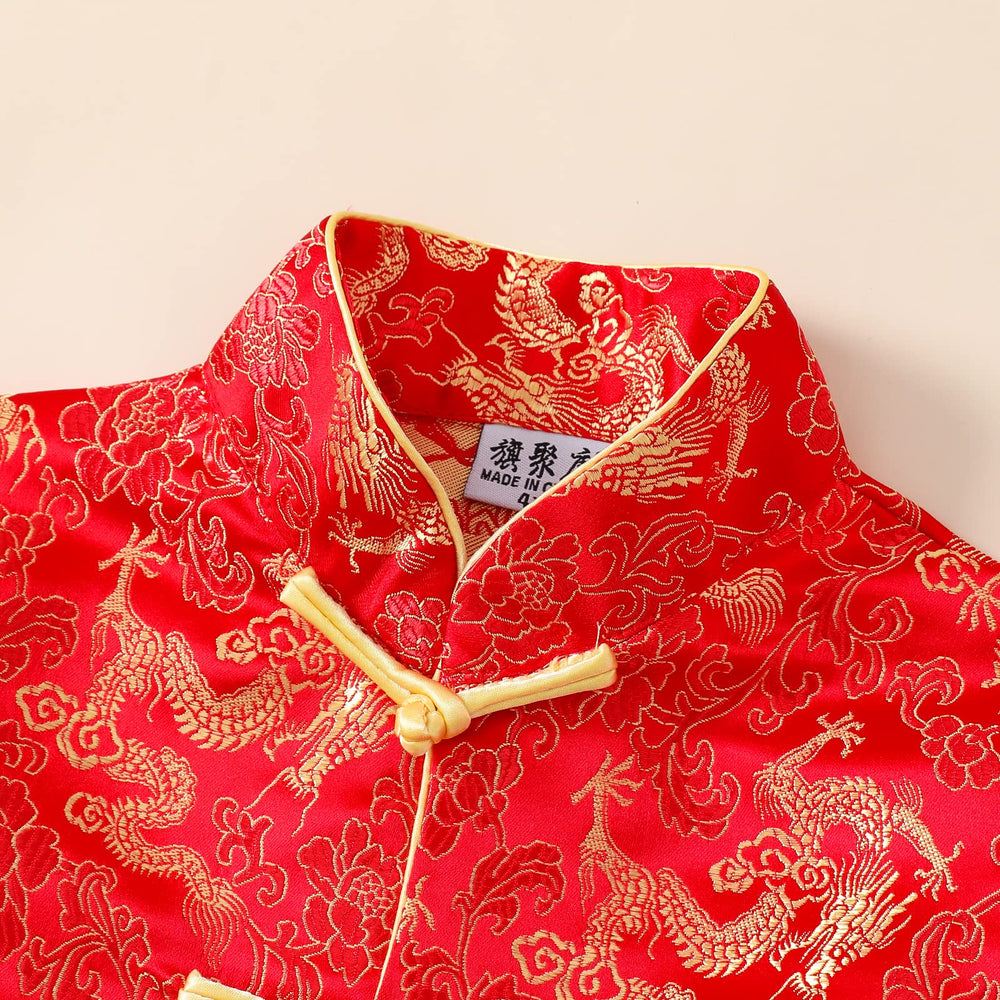 Noubeau boy wearing Tang dragon shirt, ready for a holiday photo shoot.
