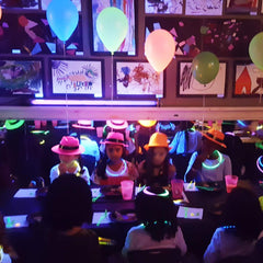 Novelty Place hats in use at a birthday party show festive energy.