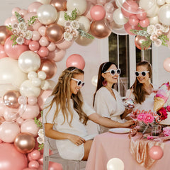 NuttyBash balloon arch backdrop assembly demonstrates easy DIY setup.