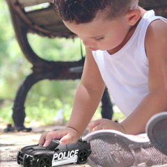 OCCAFY police car toy, wheels close-up, smooth rolling on flat surfaces.