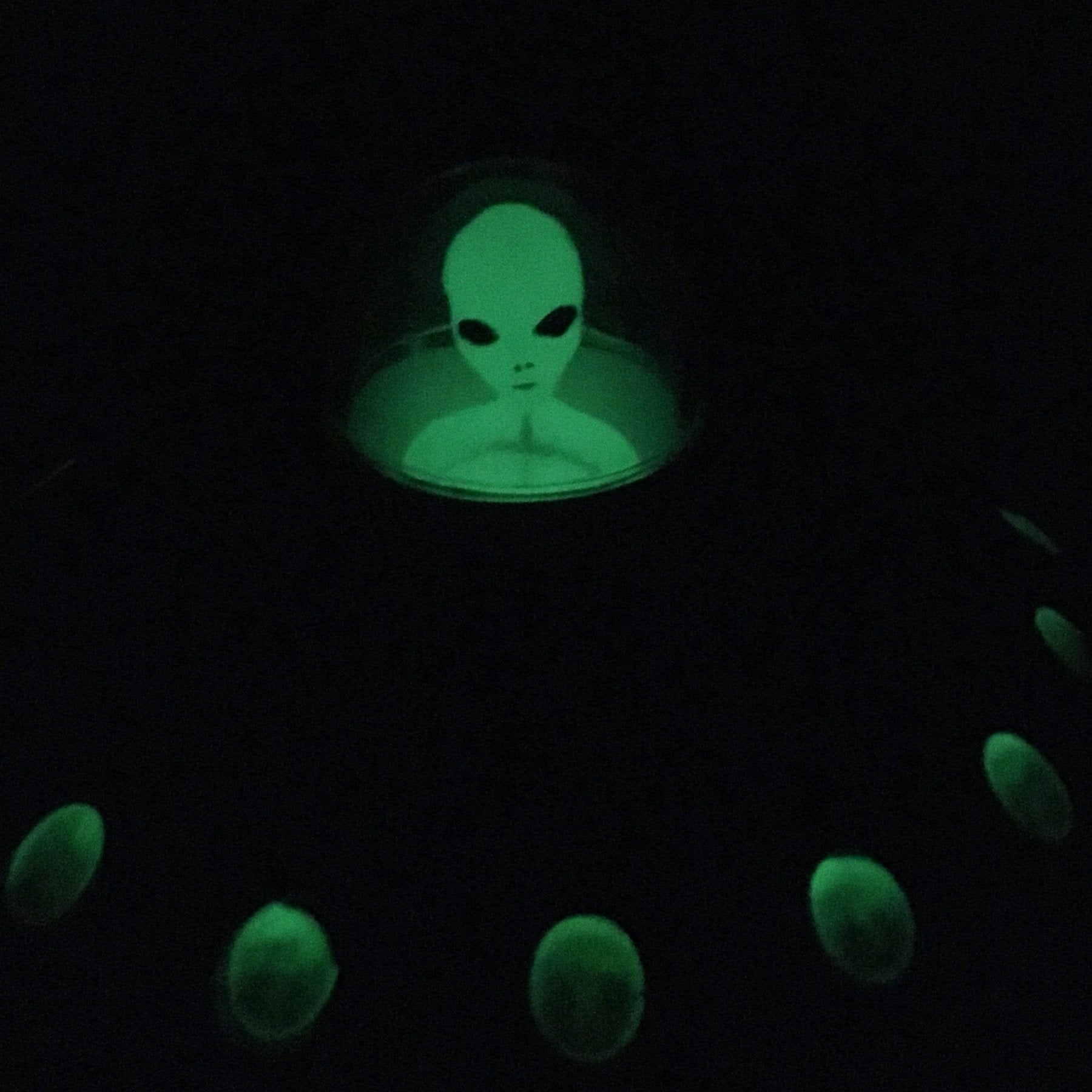 Off the Wall Toys collectible alien in a glowing UFO for display and adventures