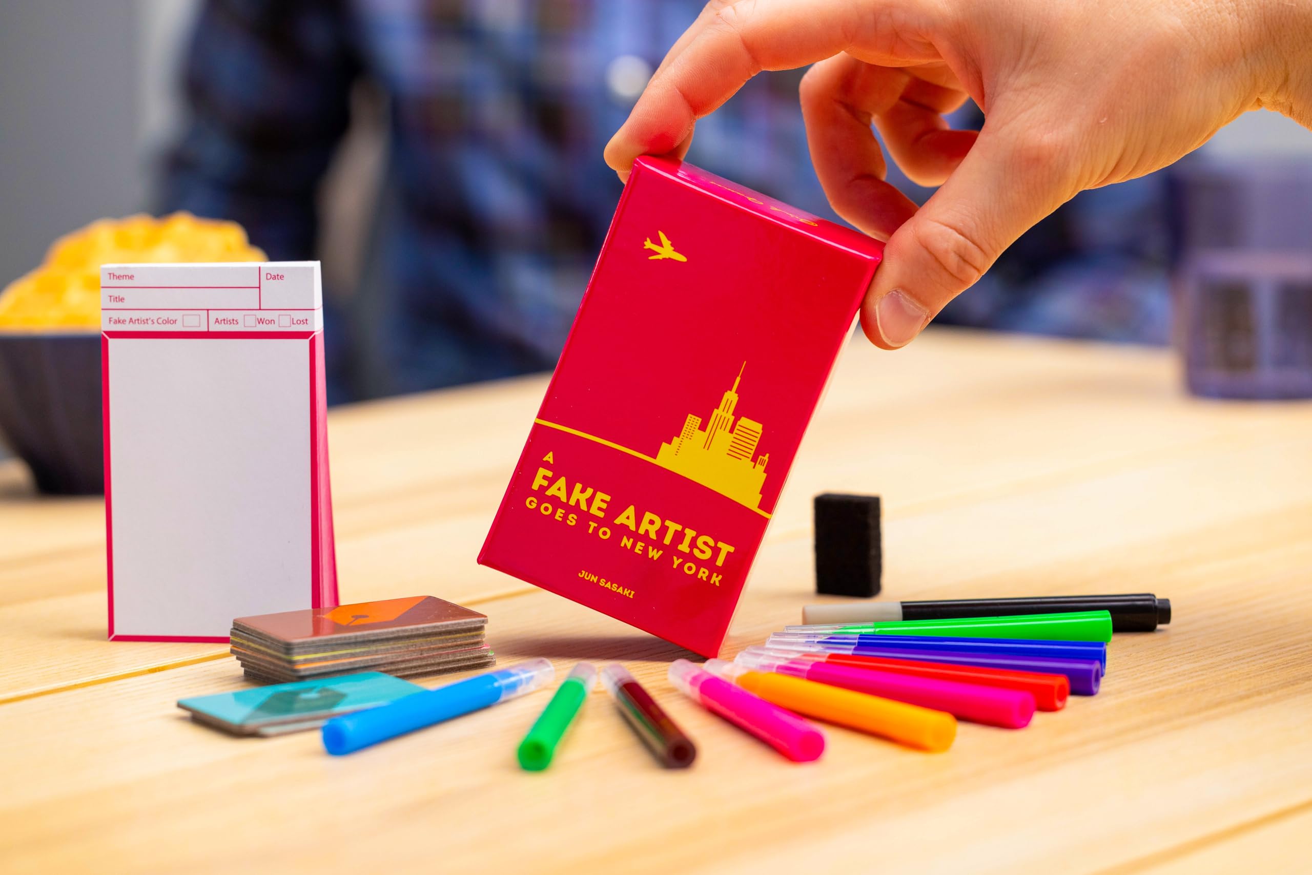 Oink Games compact party game box; portable and easy to bring along.