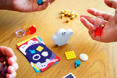 Oink Games DroPolter ghost-prompt cards on the table build suspense.