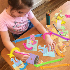 OOINQQ glow dinosaur strings in orange for rewards and play.