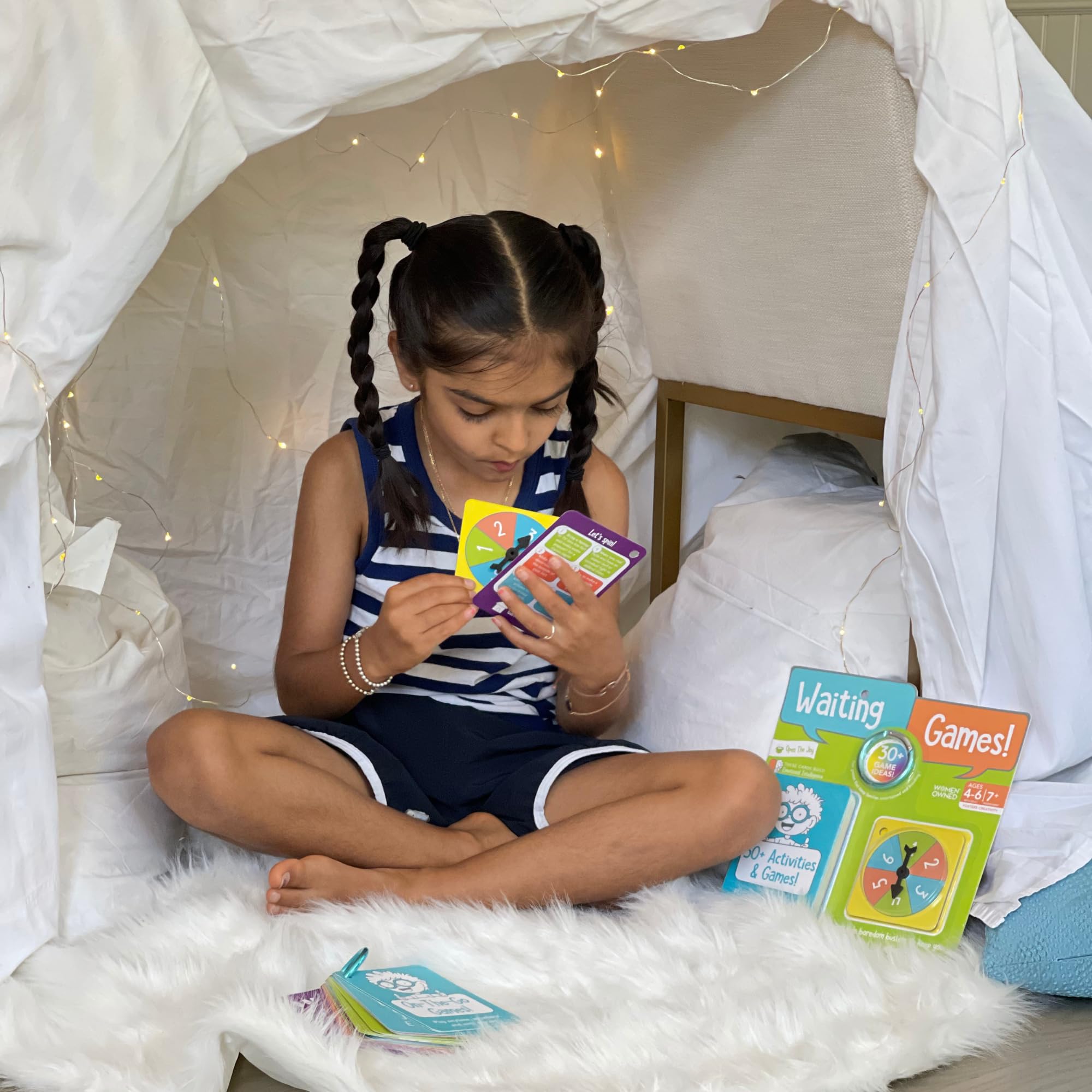 Open The Joy Waiting Games clip-on backpack access for easy travel