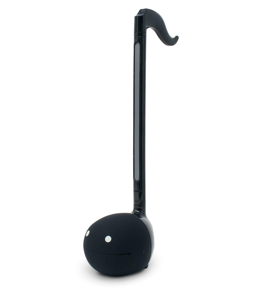 Otamatone black front view showcases portable musical creativity.