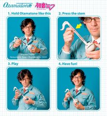 Otamatone Classic Hatsune Miku Edition squeezing cheeks evokes expressive sound during play.