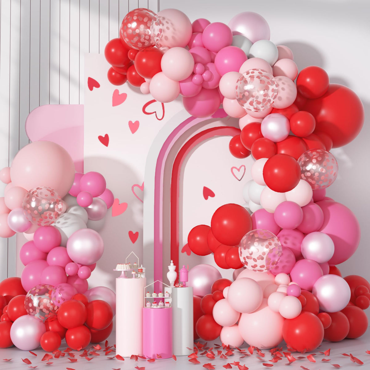Ouddy Party arch setup with red and pink balloons for a romantic centerpiece at celebrations.