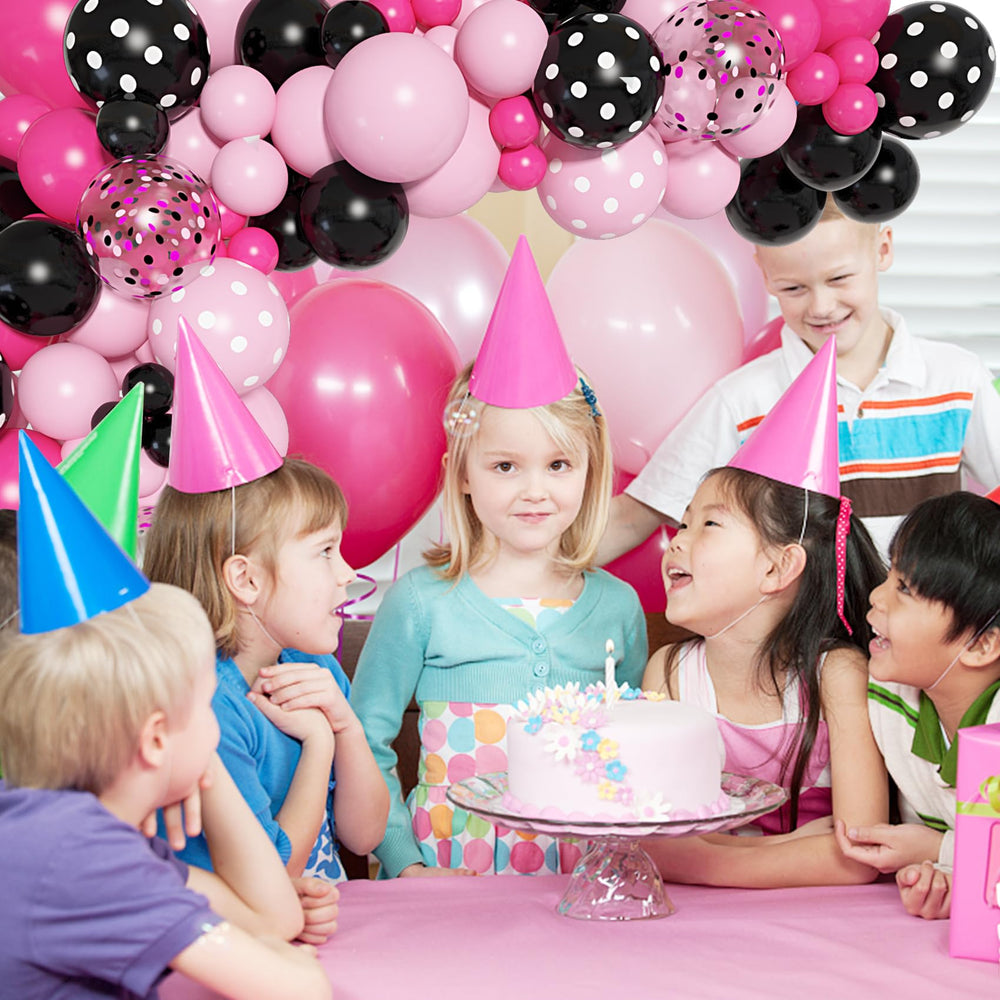 Ouddy Party assembled mouse arch display with pastel accents at party backdrop.