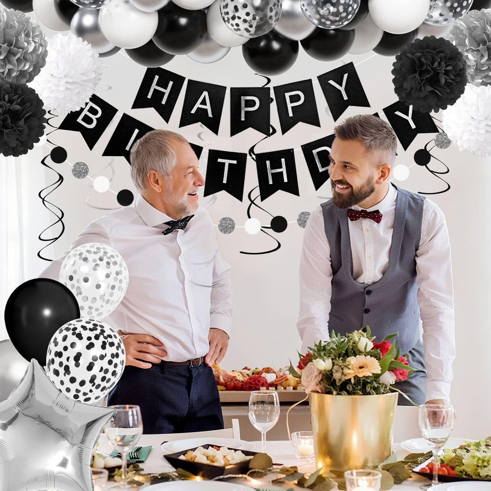 Ouddy Party tissue tassels in black pair with silver accents for a modern wall display.