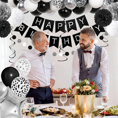 Ouddy Party tissue tassels in black pair with silver accents for a modern wall display.