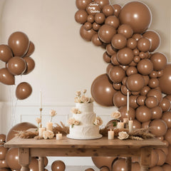 Ouddy Party 5in brown balloons create texture in centerpieces.