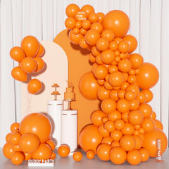 Ouddy Party burnt orange arch setup for fall celebrations