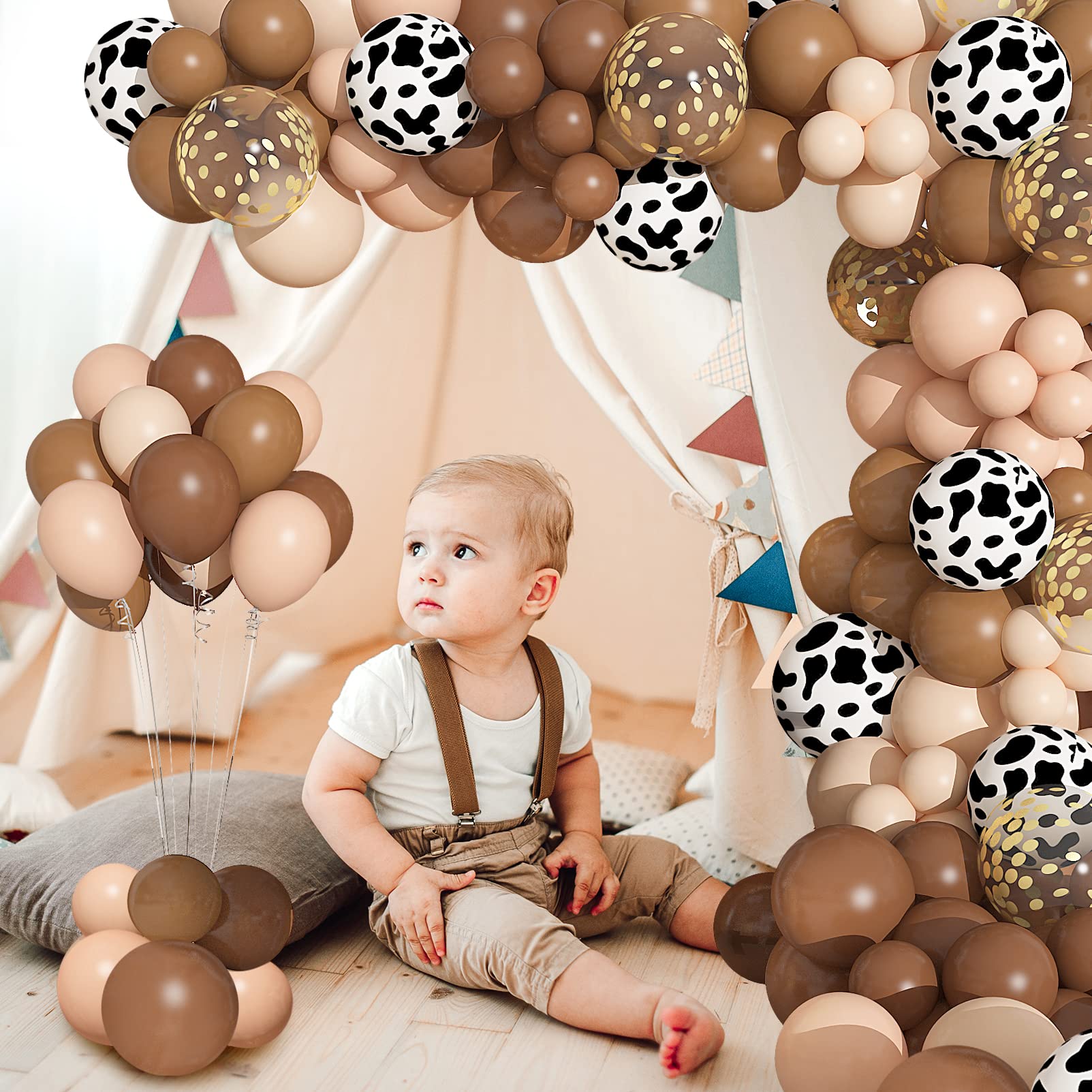 Ouddy Party cow-print balloons emphasize a playful western animal theme for any party.