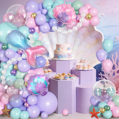 Ouddy Party green balloon accents complement ocean-inspired decorations