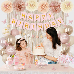 Ouddy Party paper pom-poms brighten any party setup.