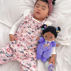 OUOZZZ 10-inch black baby doll fabric close-up highlights non-toxic, machine-washable materials.