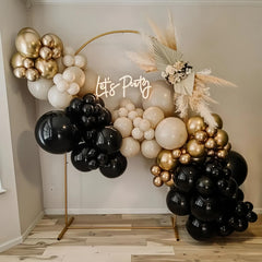 Paeyeq 12-inch and smaller balloons fill gaps for a polished arch