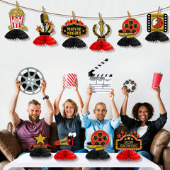 Pajean honeycomb centerpiece featuring tickets complements themed birthday decor.
