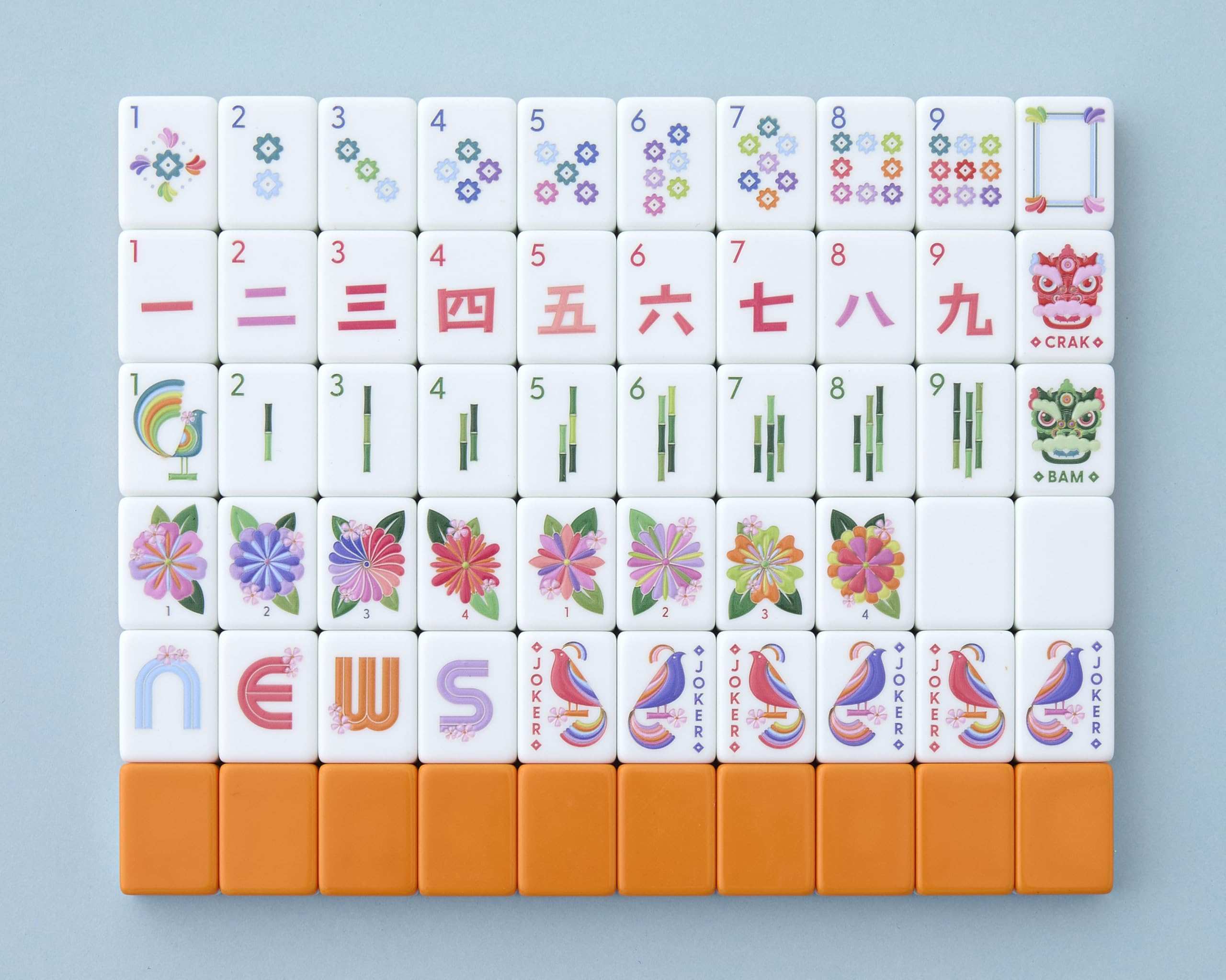 Paradise Mahjong Tiles front design with a vibrant orange back for stylish game nights.