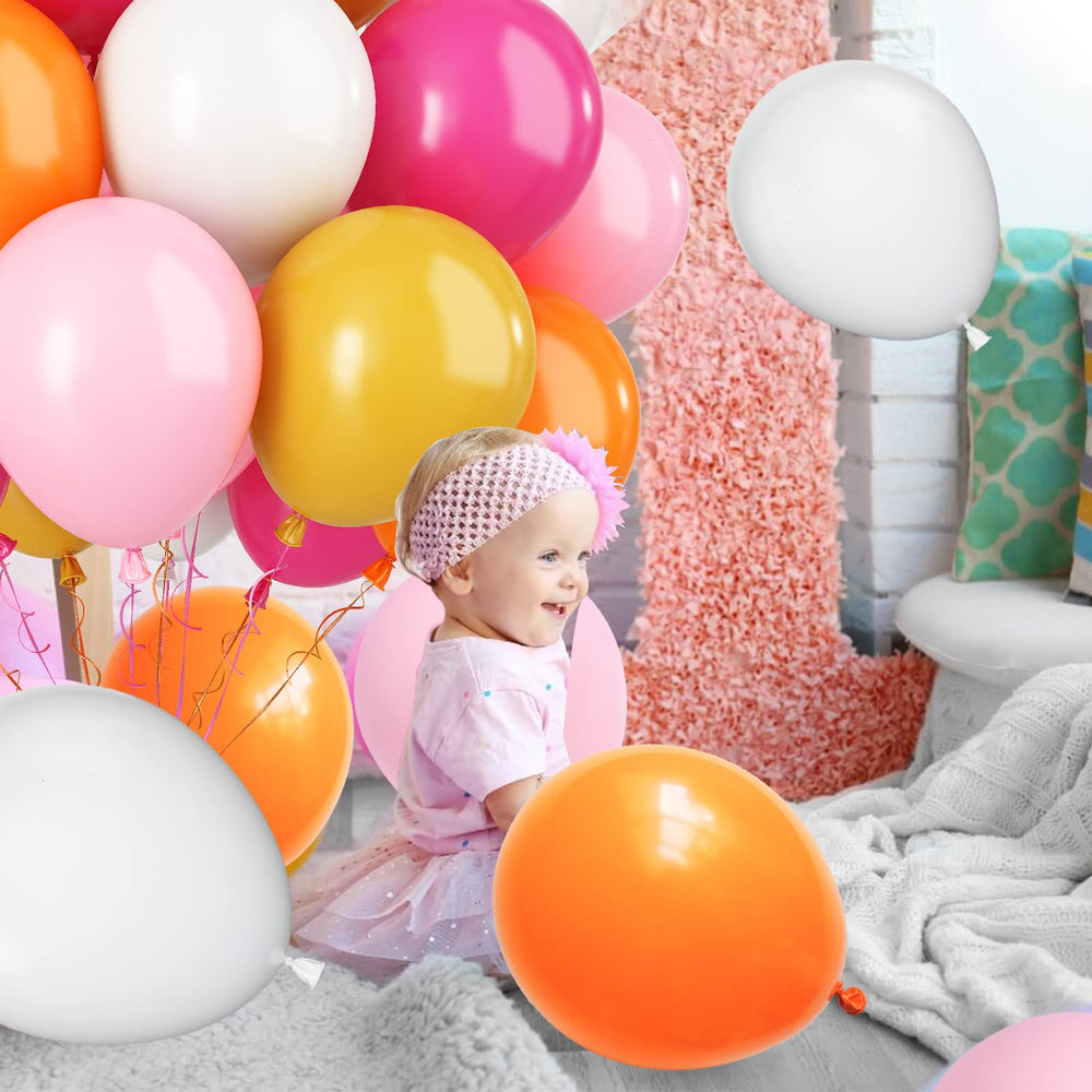 Paready birthday party decor ideas using pink and orange tones.
