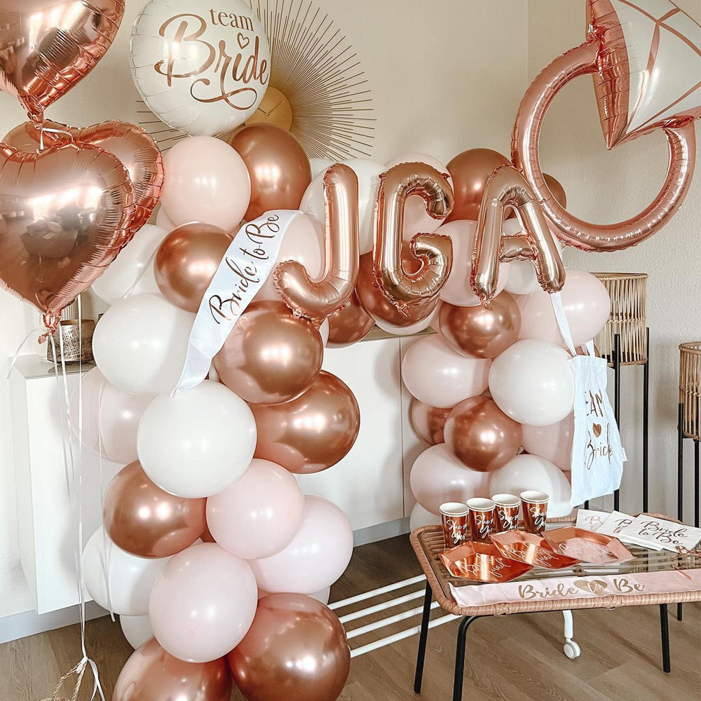 Paready matte white balloons provide soft backdrops for baby showers