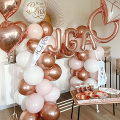 Paready matte white balloons provide soft backdrops for baby showers