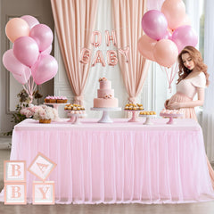 Party Talk pink tulle tablecloth drape along side for elegant decor.
