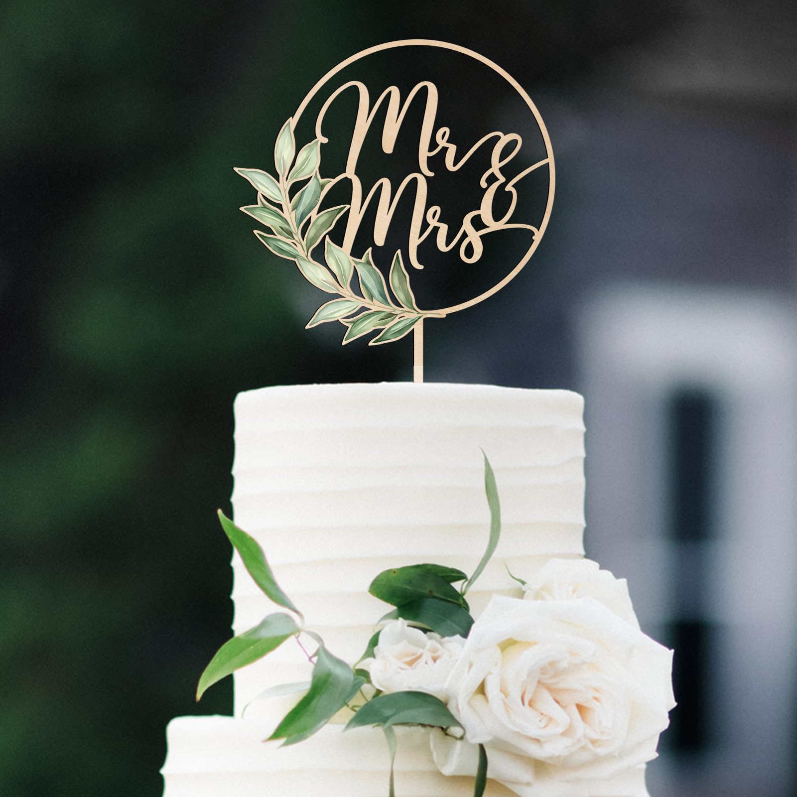 Party to Be Mr & Mrs Greeny cake topper close-up showing natural wood texture for rustic wedding.