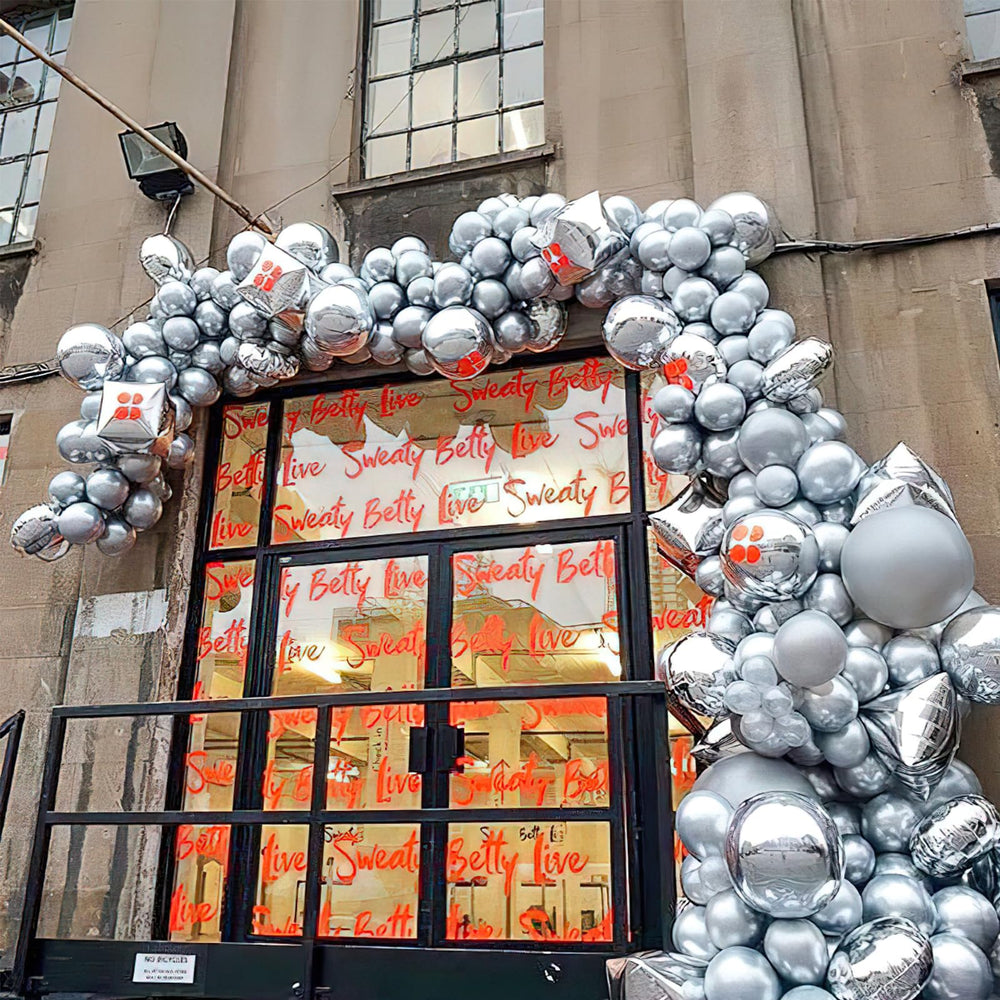 PartyWoo silver balloon arch for wedding decor or celebratory photo moments.