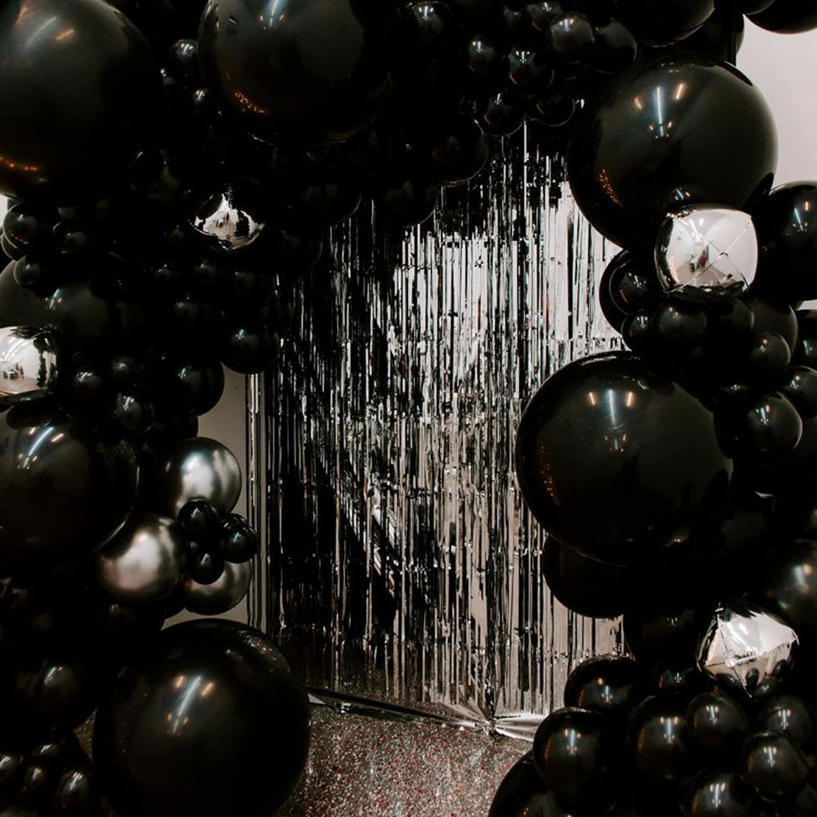 PartyWoo casino themed decor featuring bold black balloons