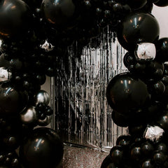PartyWoo casino themed decor featuring bold black balloons