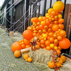 PartyWoo orange balloons birthday party decor brightens party spaces.
