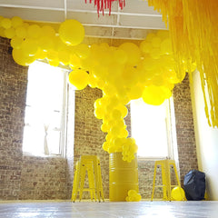 PartyWoo air-filled yellow balloons stay full longer indoors