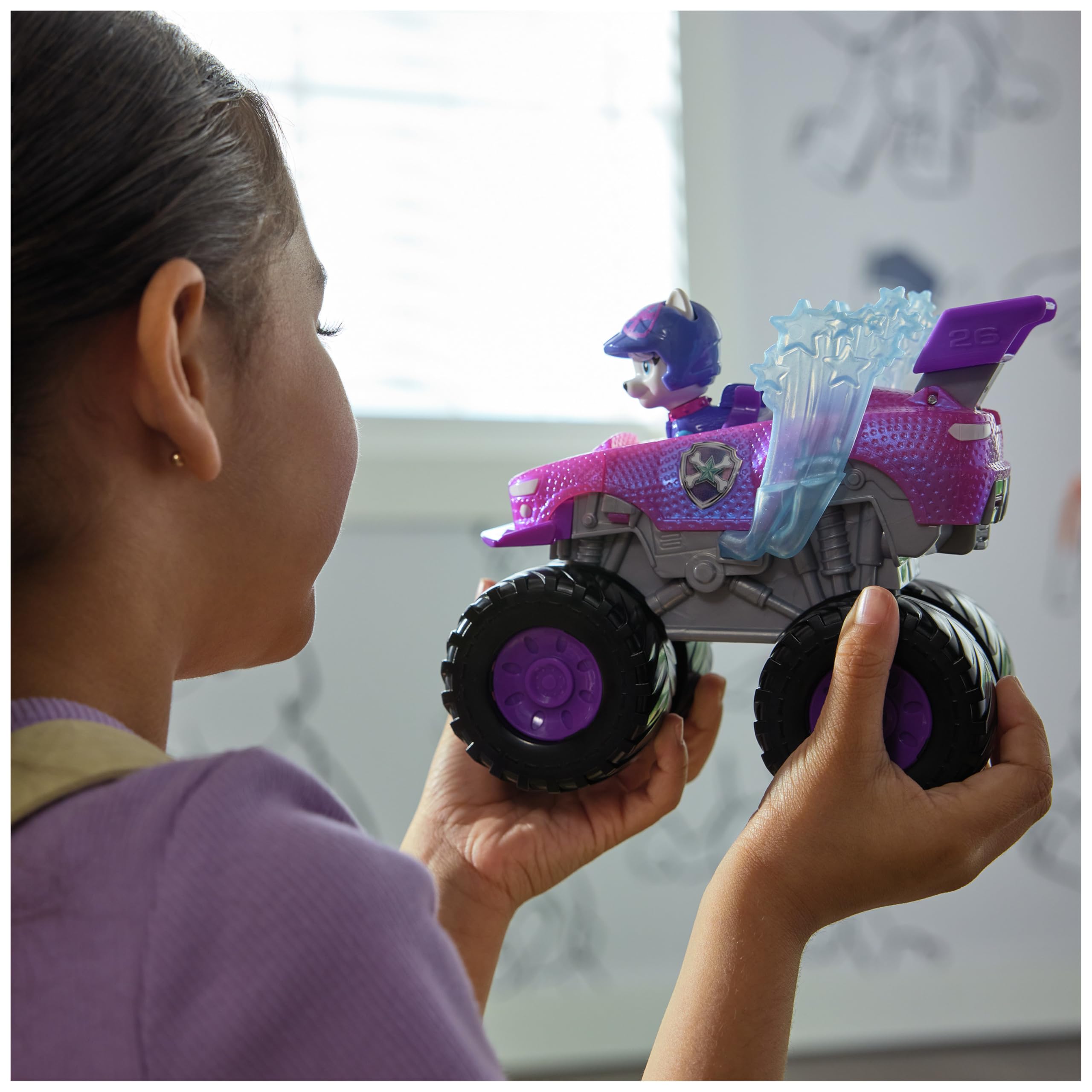 Paw Patrol Roxi truck side profile shows authentic design and oversized wheels.