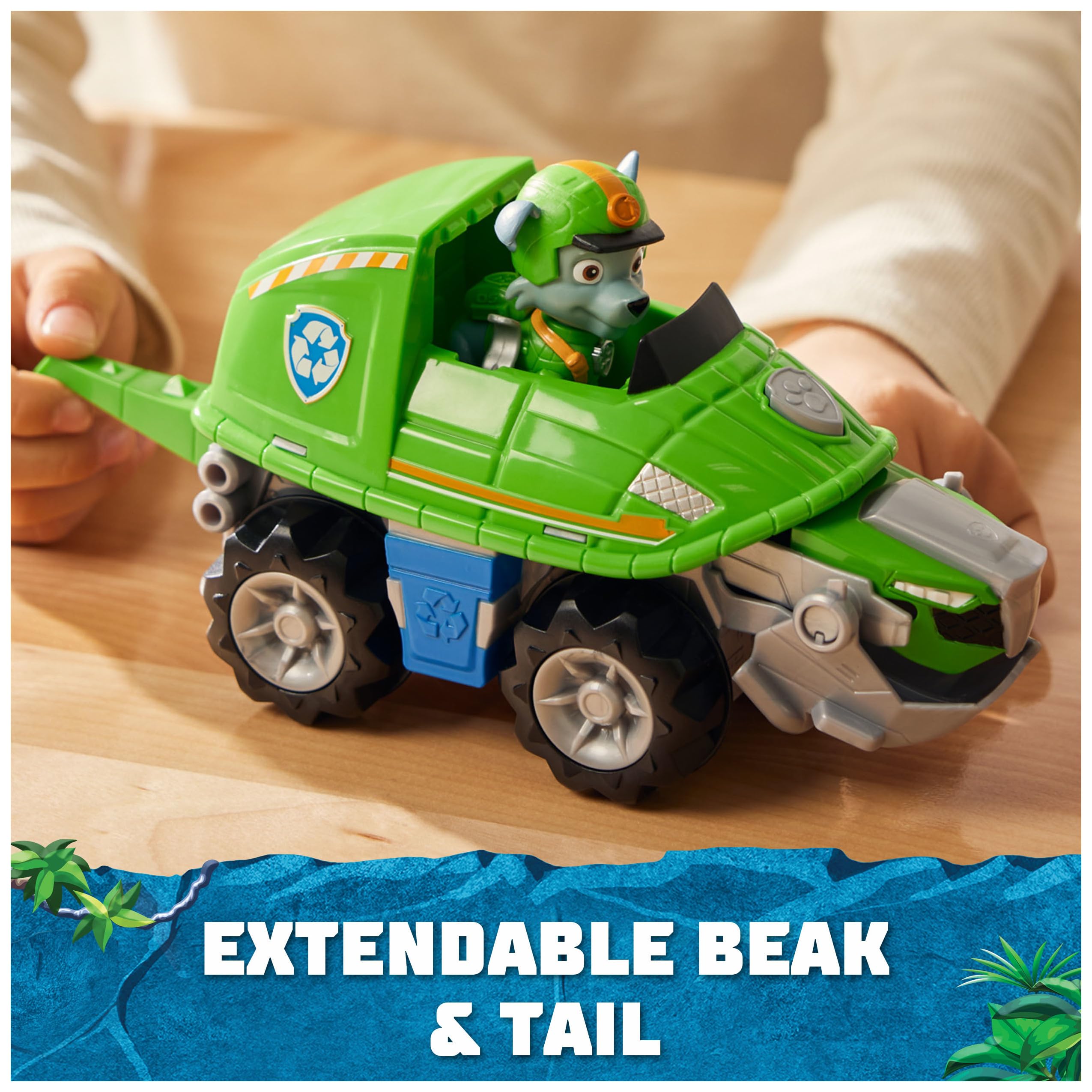 Transforming turtle action demonstrated by pushing button and pulling tail for reveal.