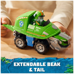 Transforming turtle action demonstrated by pushing button and pulling tail for reveal.