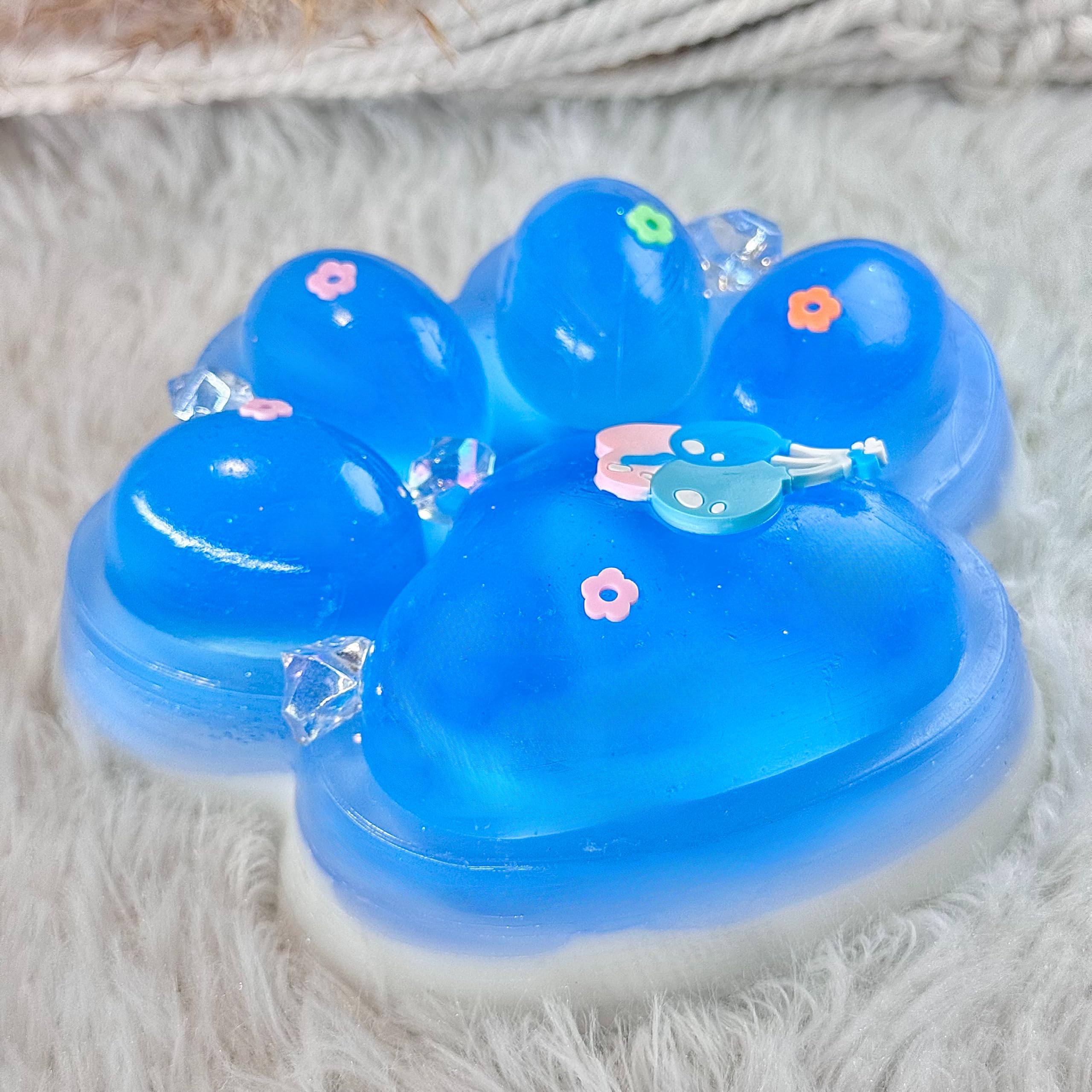 Pawfect Tail Big Taba Squishy Paw showing milky white base for soothing tactile play