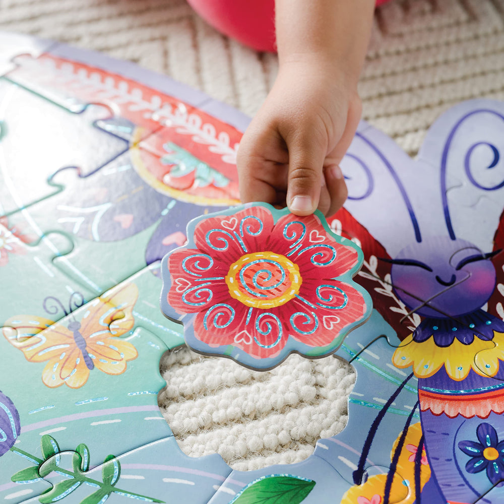 Peaceable Kingdom 53-piece butterfly puzzle invites ages 5 and up to explore and cooperate.