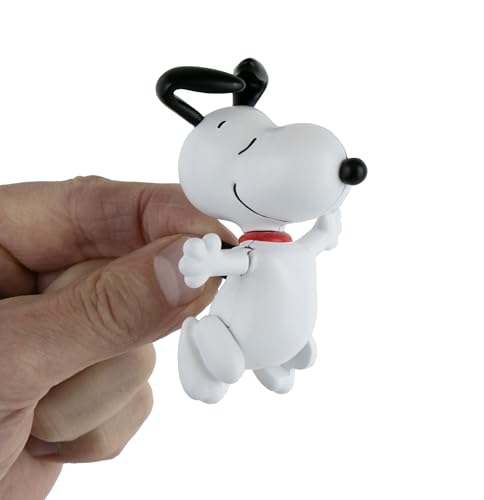 Peanuts Snoopy mini dancing figurine, nostalgic display piece for fans.