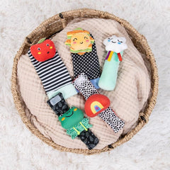 The Peanutshell sock rattles set arrives gift-ready for new parents.