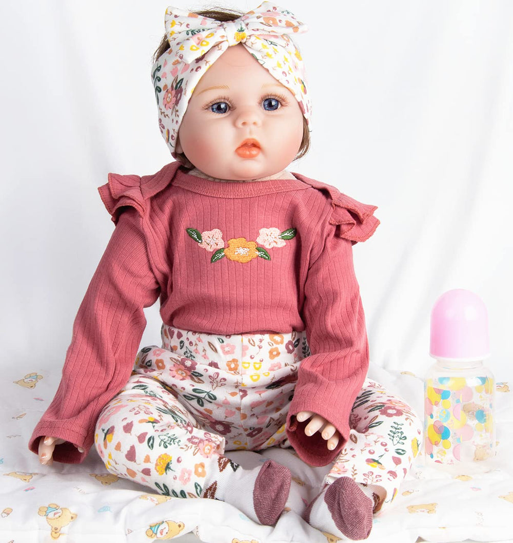 Pedolltree Reborn 22in socks complete a cozy outfit.