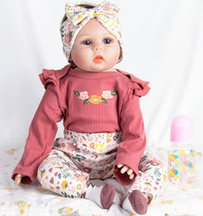 Pedolltree Reborn 22in socks complete a cozy outfit.