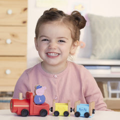 Peppa Pig child playing with wooden train inspires creative pretend journeys
