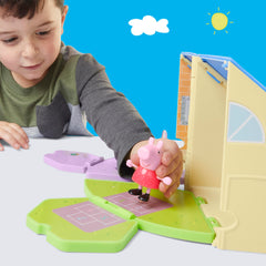 3-inch Peppa Pig figure wearing a red dress sits at playset furniture.