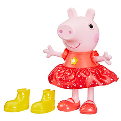 Peppa Pig Muddy Puddles Party doll in a glittery dress with yellow boots ready to dance.